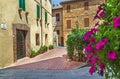Pienza, Italy Ã¢â¬â July 22, 2017: Old cozy street in italian ancient town Pienza. Siesta hour.